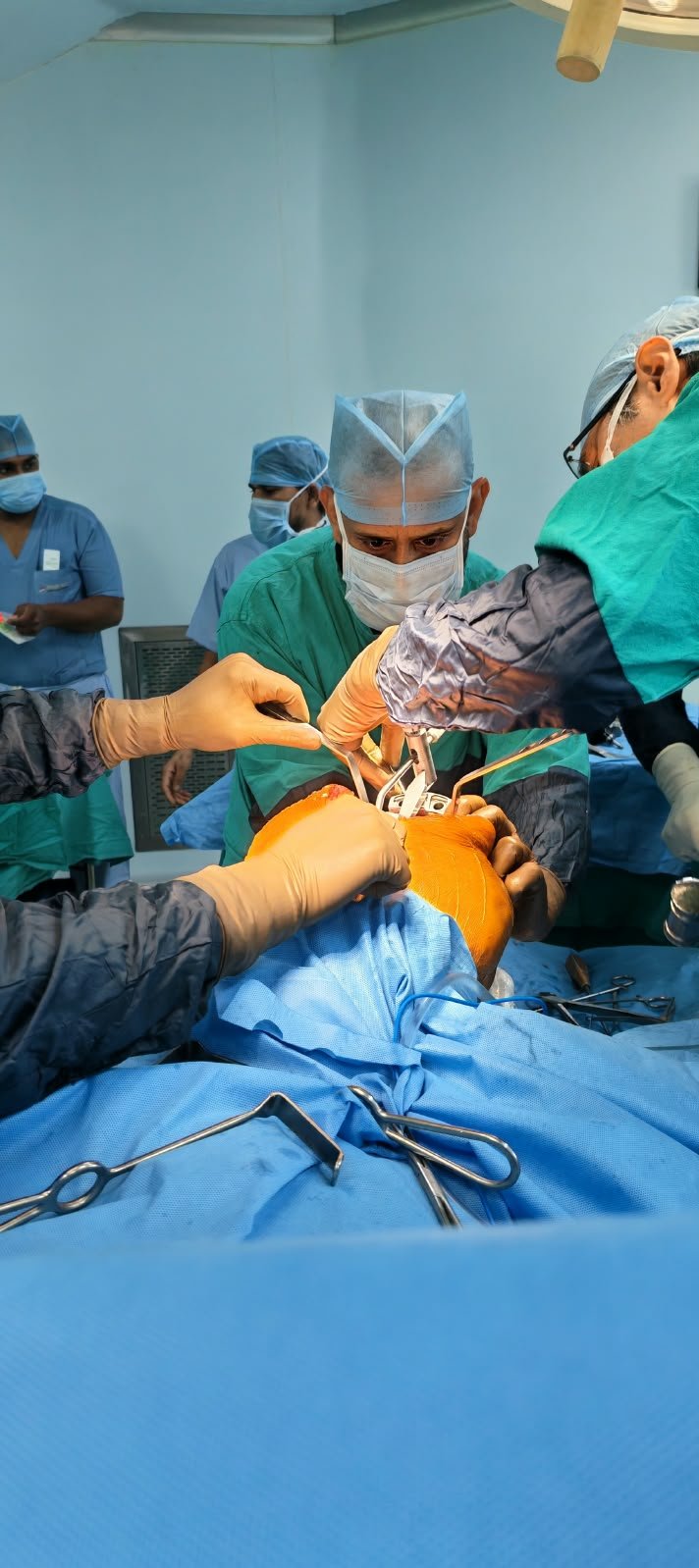 Dr. Hussain performing surgery